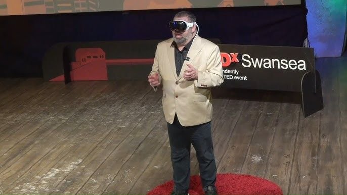 Sam Sammane on stage at TEDxSwansea