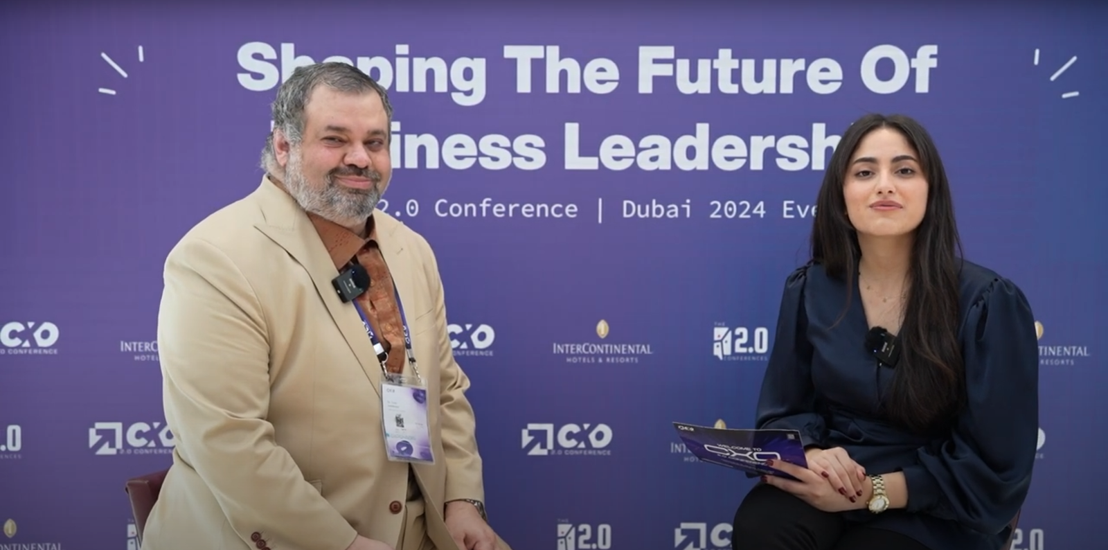 Sam Sammane interviewed on the CXO 2.0 Conference Dubai 2024 set, backdrop reading Shaping the Future of Business Leadership